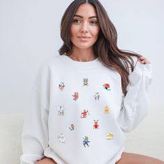 HOLIDAY ORDER DEADLINES TO ENSURE DELIVERY BY XMAS- USA- DEC 12 2023 CANADA- NOV 28 2023 EUROPE- CAN'T GUARANTEE ARRIVAL BY XMAS Get ready to hit the slopes in adorable style with our Cute Animal Ski Sweatshirt! This winter wonder showcases cute little animals hitting the slopes, adding a whimsical touch to your skiing adventures. Made from soft and cozy fabric, this sweatshirt is perfect for showcasing your love for both winter sports and charming critters. Embrace the snowy vibes with our playful and stylish Animal Ski Sweatshirt - where cute meets comfort on the slopes!Designed with a perfect blend of soft cotton and breathable polyester, this classic heavy-blend crewneck sweatshirt fits comfortably and is great for warm weather. The side seams are also stitched to prevent irritation. - Playful Winter Crew Neck Sweatshirt, Playful Crew Neck Winter Sweatshirt, Playful Crew Neck Hoodie For Winter, Casual White Sweatshirt For Winter Sports, Casual Tops For Winter Sports, White Crew Neck Sweatshirt For Winter Sports, Playful White Sweater With Graphic Print, Playful White Sweatshirt For Loungewear, White Long Sleeve Sweatshirt For Winter Sports