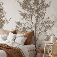 a bed sitting under a tree wallpaper next to a wooden table and white chair