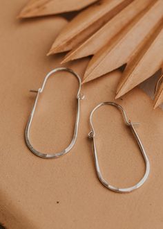 These hoops have just the right amount of movement thanks to the perfect amount of hammered texture and the swing latch design. Measures 2" long by 1" wide. Hoop hinge is made of 18g wire. Sold as a pair. Available in 14kt Gold Fill + Sterling Silver. Paired with our best-selling earring, the Tiny Twist Earrings. Handmade in Eau Claire, WI. Our jewelry is handmade so each piece will be unique and may vary slightly from what is pictured. Soldering Projects, Twist Earrings, Adornment Jewelry, Anna Beck, Everyday Wear Jewelry, Hammered Jewelry, Earring Inspiration, Urban Rustic, Metal Smithing