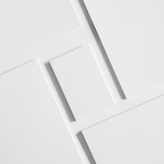 four square pieces of white paper on top of each other