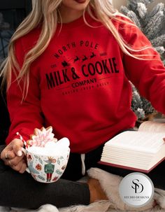 Snuggle up this holiday season with the cozy and festive Milk and Cookie Company crewneck sweatshirt. Featuring a vintage-inspired design, this sweatshirt is perfect for spreading Christmas cheer and enjoying the warmth of the season. Made from a soft, high-quality Gildan fabric, this crewneck offers both comfort and style, whether you're lounging by the fireplace or baking cookies. Ideal for gifting or adding to your holiday wardrobe, this sweatshirt brings a touch of nostalgia with its charming design. Material: Gildan cotton blend for ultimate comfort Fit: Unisex sizing, relaxed fit for a cozy feel Design: Milk & Cookie Company  Occasions: Perfect for casual outings, baking cookies, or as a thoughtful Christmas gift Gift Ideas: Ideal for baking cookies, casual outings, or those looking Simple Christmas Crewneck, Holiday Cozy Crew Neck Sweatshirt, Cozy Holiday Crew Neck Sweatshirt, Cozy Holiday Sweatshirt With Crew Neck, Cozy Crew Neck Holiday Sweatshirt, Christmas Crew Neck Loungewear Sweater, Christmas Crew Neck Sweater For Loungewear, Christmas Cotton Sweatshirt For Loungewear, Cozy Crew Neck Top For Christmas