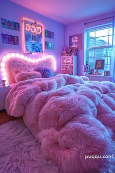 a bed with pink fluffy blankets and lights