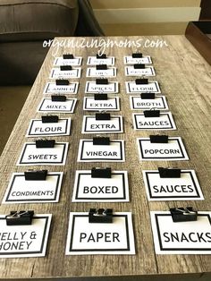 a wooden table topped with lots of signs