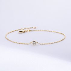 Solitaire Diamond Bracelet in 14K or 18K solid Gold, Bezel Set Dainty Diamond by the Yard Bracelet, Minimalist Bracelet Gift for Women, Graduation Gifts, Gift For Valentine, Gift For Birthday, Gift For Bridesmaid, Wedding Gift For Her ► Adding a customized tiny bar at clasp may be a good idea: https://etsy.me/3cn9OQ5 Material: Solid Gold, real gold (not gold plated or gold filled material) Karat: 14K (585), 18K (750) Gemstone: Genuine Diamond Available diamond options (size mm - weight ct): 1.80 Everyday 14k Gold Bracelet With Bezel Setting, Everyday 14k Gold Bracelets With Bezel Setting, 14k Gold Dainty Bezel Set Bracelet, Minimalist 14k Gold Bracelets With Bezel Setting, Yellow Gold Bracelet With Bezel Setting For Everyday Wear, Everyday Yellow Gold Bracelets With Bezel Setting, 14k Yellow Gold Chain Bracelet With Bezel Setting, 14k White Gold Bracelet With Single Diamond, Classic Gold Chain Bracelet With Bezel Setting