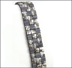 Use Quarter, Half and Full Miyuki tilas in this fun Geometrical Band Bracelet. The Pattern is a variation of a Miyuki bracelet pattern and is suitable for all levels of beaders. Finished bracelet measure 5/8 of an inch wide by 8 inches long. Closure is a 2 strand tube bar clasp. The kit includes everything you need including step by step instructions, needles and thread. Shades of White bracelet comes with edge beads. The other two colors do not, however there is one photo showing how it would l Miyuki Bracelet Pattern, Mrs Necklace, Diamond Cross Necklace Gold, Bracelet Miyuki, Tila Beads, Bracelet Kit, Miyuki Bracelet, Bead Weaving Patterns, Bracelet Kits