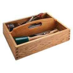 a wooden box filled with different types of tools