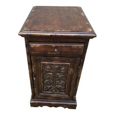 an old wooden cabinet with carvings on the front and bottom drawer, isolated against a white background