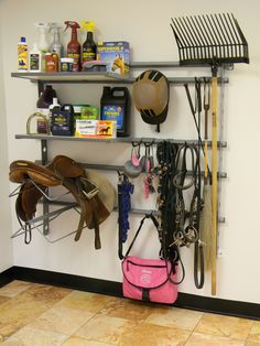 there is a rack with many different items on it and one pink bag in the foreground