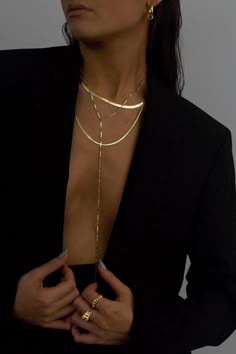 A lightweight showpiece, the Cressida 14K Gold-filled Y necklace, was designed to effortlessly move with you. The elongated flat bars reflect on the skin, creating a subtle yet lustrous glow. Crafted with a dramatic elongated drop, to perfectly accent v necklines or swimsuits, an alluring combination of necklace and body chain.Material: 14K Gold-filled Dimension: 16.5 to 19 inches adjustable, 12.5 inch drop, 2mm chain width What is 14K Gold-filled? A thick gold layer (100 times more gold than go Jewelry Capsule, Modern Gold Jewelry, Jewelry Wardrobe, Lana Jewelry, Y Necklace, Necklace Collection, Jewelry Essentials, Demi Fine Jewelry, Jewelry Photography