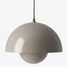 a white light hanging from a ceiling fixture