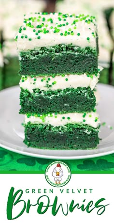 green velvet brownies stacked on top of each other with white frosting and sprinkles