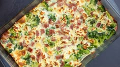 a casserole dish with broccoli, ham and cheese