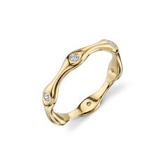 a gold ring with diamonds on it