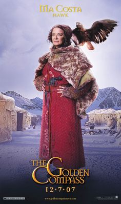 the golden compass movie poster with an image of a woman in red dress and large bird on her shoulder