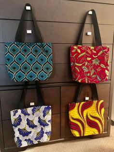 100% African wax cotton  Lined with black felt Large inside pocket  Black fabric straps  14x14 Ankara Tote Bag, Tote Bag Design Ideas, Bag Design Ideas, African Gifts, Canvas Bag Design, African Bag, Fabric Tote Bag, Gift For Mom Christmas, Fabric Tote Bags