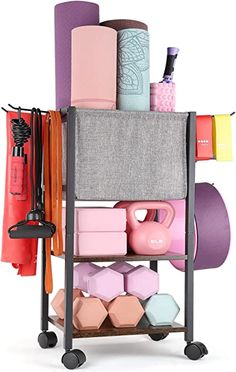 a rack with yoga mats, dumbs, and other items on top of it