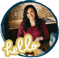 a woman standing in front of a table with food on it and the words hello written over her