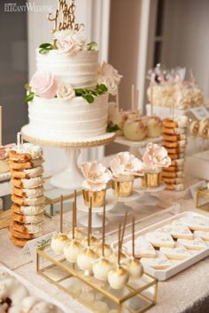 a table topped with lots of cakes and desserts