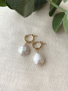 These stunning Coin Pearl Hoop Earrings are the perfect balance of bold and dainty! They make beautiful special occasion earrings, or remove the pearl charm and wear the hoops for an everyday casual style! These are some of the nicest quality Coin Pearls I have come across! Pair them with the matching Del Mar Necklace to create a dreamy Pearl set! * 14mm (removable) genuine Coin Pearl charms * 13mm 14K Gold Filled or 925 Sterling Silver Leverback Hoops * 14/20 gf or 925 stamp for authenticity * Small Hoop Earrings For Wedding, Small Hoop Pierced Earrings For Wedding, Wedding 14k Gold Filled Pierced Hoop Earrings, Pearl Charm Huggie Earrings For Anniversary, Small Hoop Single Earring For Wedding, Anniversary Pearl Charm Huggie Earrings, Anniversary Huggie Earrings With Pearl Charm, Handmade Pearl Hoop Earrings For Anniversary, Handmade Hoop Pearl Earrings For Anniversary