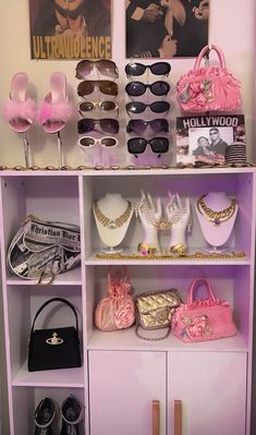 a shelf filled with lots of different types of purses and sunglasses on top of it