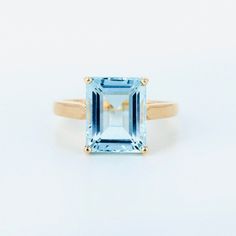 Add this beautiful aquamarine ring to your jewellery collection. Makes for a great gift. We used natural Aquamarine of the finest quality. Product Details > Gemstone - Aquamarine > Materials - 14K Yellow Gold > Gemstone Shape - Rectangle shape > Gemstone weight - 4.71 carats > Gemstone Size: 9X11 mm Rectangle Approx > Ring size : 7 1/2 US > Number of gemstone - 1 pcs > Gross Weight - 4.190 grams > Setting type - prong setting *Production Time: Generally we keep stock of all products but if by an Aquamarine Gemstone Ring For Promise, Aquamarine Gemstone Promise Rings, Aquamarine Birthstone Promise Ring, Blue Aquamarine Solitaire Ring, Fine Jewelry Aquamarine Birthstone Ring For Formal Occasions, Aquamarine Solitaire Birthstone Ring For Anniversary, Blue Aquamarine Birthstone Ring, Formal Aquamarine Topaz Birthstone Ring, Classic Light Blue Aquamarine Jewelry