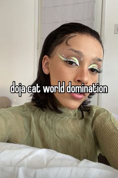 a woman with makeup on her face and words that say doja eat world domination