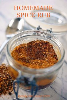 homemade spice rub in a glass jar with spoons