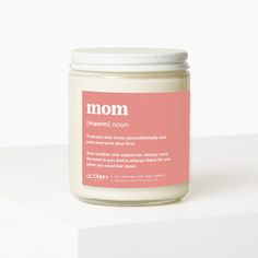 a jar of mom's natural deodorant sits on a white surface