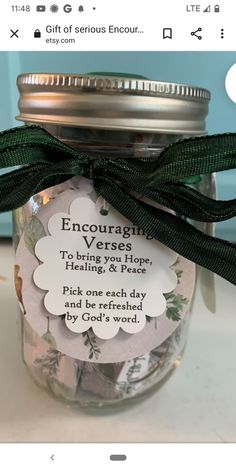 a jar filled with lots of coins on top of a table