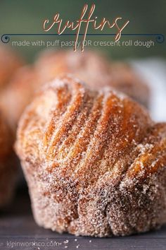 some sugar covered muffins sitting on top of a table