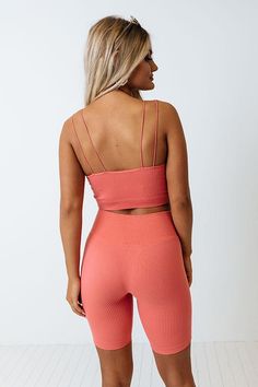 Add a pop of color to your athleisure wardrobe with our cute dusty rose colored 'Up At Dawn' tank featuring lightweight four-way stretch material with subtle vertical ribbed texturing, a scooped neckline, four spaghetti straps, and a flattering figure hugging silhouette that ends in a straight cropped hemline!  on products                                                                    Measurements S-M :  Bust 23", Length 9.5", Waist 21".  L-XL :  Bust 25", Length 10.5", Waist 23". Sporty Ribbed Scoop Neck Sports Bra, Pink Workout Tank Top With Built-in Bra, Stretch Seamless Activewear For Spring, Summer Ribbed Gym Tank Top, Ribbed Scoop Neck Sporty Activewear, Pink Spring Activewear With Built-in Bra, Summer Gym Ribbed Tank Top, Summer Activewear With Seamless Construction And Scoop Neck, Summer Seamless Scoop Neck Activewear