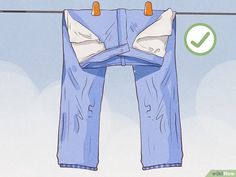 a pair of jeans hanging on a clothes line with an arrow pointing to the left