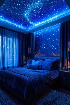 a bedroom with stars on the ceiling and blue curtains, lights in the window sill