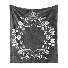 a black and white wall hanging with a crown on it