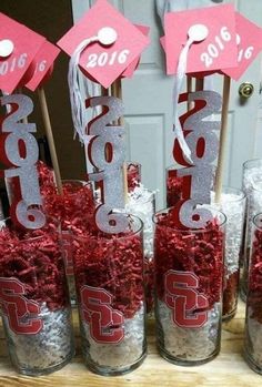 red and silver graduation decorations in glass jars