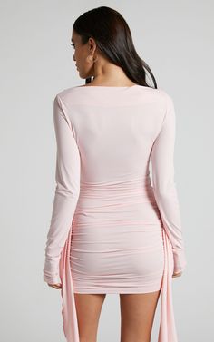 Blush V-neck Party Dress, Blush V-neck Dress For Party, Pink V-neck Bodycon Dress For Evening, Flirty Pink Mini Length Bodycon Dress, Pink Fitted Flirty Mini Dress, Pink Fitted Ruched Mini Dress, Fitted Pink Ruched Mini Dress, Fitted Flirty Pink Mini Dress, Fitted Ruched Pink Mini Dress