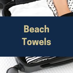 the beach towels are packed in an open suitcase