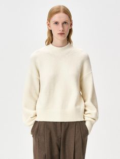 This cozy wool-blend turtleneck sweater features a semi-oversized silhouette perfect for versatile styling throughout the cold seasons. The premium fabric blend combines 70% acrylic with wool, nylon, and spandex for the ideal balance of warmth and comfort. Available in beige and black, this sweater can be worn solo or layered, making it an essential addition to any fall/winter wardrobe.Color: beige, black, cream Wardrobe Color, Oversized Turtleneck Sweater, Oversized Turtleneck, Sweater Cream, Fall Winter Wardrobe, Beige And Black, Oversized Silhouette, Cold Season, Premium Fabric