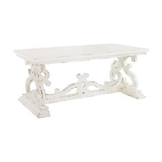 a white table with an ornate design on it's top and bottom shelf, in the shape of a bench