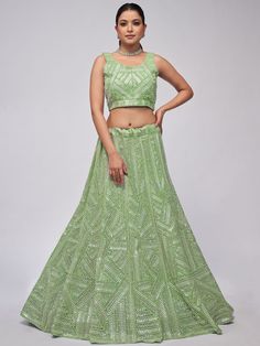 Elevate your Mehendi look with our marvelous green heavy sequins net lehenga choli. This stunning ensemble features captivating green net material adorned with heavy sequin work and intricate thread embroidery. The monochrome green color exudes elegance and sophistication, making it perfect for weddings, cocktail receptions, engagements, and Mehendi ceremonies.
The semi-stitched lehenga can be customized up to 42 inches, ensuring a perfect fit for any body shape. The unstitched blouse material g Anarkali Lehenga Gowns, Mehendi Look, Engagement Gown, Net Lehenga Choli, Lehenga Crop Top, Saree With Belt, Lehenga Choli Wedding, Party Wear Lehenga Choli, Reception Gown