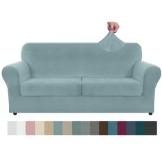 a blue couch with two hands on it and color swatches in front of it