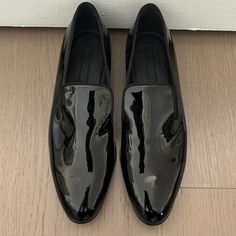 Hugo Boss - Black, Patent Leather Slipper Sophisticated, Sleek, Black Patent Leather Slip On Loafer With Silk Grosgrain Ribbon Trim Covering All Edges. Seamless Flat Front With An Almond Shaped Toe, Lightly Padded Footbed And Notches On Each Side Of The Tongue Giving You That Fashionable Slipper Look. Leather Upper. True To Size. Made In Italy. Never Worn. No Box. Smoke Free, Pet Free Home. Hugo Boss Shoes, Boss Shoes, Boss Black, Almond Shaped, Leather Slippers, Ribbon Trim, Black Patent Leather, Leather Slip Ons, Hugo Boss