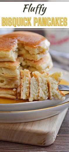 a stack of pancakes on a plate with butter and syrup next to it is the words fluffy biscuit pancakes