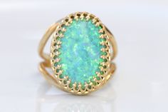 GREEN OPAL RING, Opal Gold Ring, Gemstone ring, October Birthstone, Opal Emerald lawn Gold Filled Ring, Fire Opal jewelry, Opal Big Ring Statement green opal ring made of 14k gold filled the stone is 13*18 mm , it is a perfect to give as a gift for woman Measurements: Size- available all size The center stone is 18mmx13mm Gemstone is a lab opal The ring will be packed in a gift box. FOR MY RINGS COLLECTION HERE: https://www.etsy.com/il-en/shop/rebekajewelry?section_id=14282915&ref=shopsectio Elegant Green Opal Oval Ring, Fine Jewelry Green Opal Ring, Green Oval Opal Ring For Formal Occasions, Unique Green Emerald Ring With Gemstone Accents, Unique Green Jewelry With Accent Stones, Unique Green Emerald Ring With Stone Setting, Unique Green Cabochon Opal Ring, Handmade Green Opal Round Ring, Oval Green Emerald Ring With Gemstone Accents