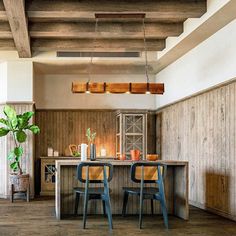 a dining room with two chairs and a table