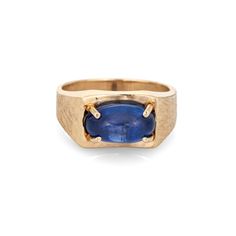 "Stylish vintage natural Ceylon star sapphire ring crafted in 14 karat yellow gold (circa 1970s).  Natural star sapphire, approx. 5.30ct (12.1 x 7.0 x 5.8mm), medium-dark blue color, lightly included, high polish. A faint star is visible under a pinpoint light source. Color and inclusions are typical of star sapphires from Ceylon (Sri Lanka). There is no evidence of any treatments to the stone.  Set in an east to west position, the star sapphire glows in natural sunlight. The gemstone is securely prong set with a florentine finish to the side shoulders. The ring makes a nice statement on the hand. The medium rise ring (7.5mm - 0.29 inches) sits comfortably on the finger.  Included is a report from Guild Laboratories with an \"Estimate of Retail Selling Price New for Comparison Purposes\" - Collectible 14k Gold Sapphire Ring With Gemstone, Collectible 14k Gold Sapphire Ring, Collectible Sapphire Ring In 14k Gold, Vintage Yellow Gold Sapphire Jewelry, Oval Cabochon, Yellow Gold Sapphire Jewelry Oval Cabochon, Yellow Gold Oval Cabochon Sapphire Jewelry, Classic Sapphire Oval Cabochon Jewelry, Vintage Sapphire Birthstone Jewelry, Vintage Oval Sapphire Jewelry