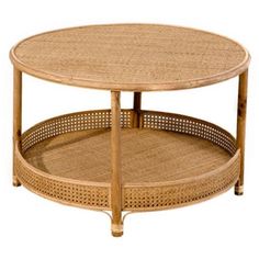 a round coffee table with two trays on each side and wicker design around the top