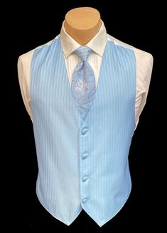 Light Blue Jean Yves Tuxedo Vest & Tie This is a handsome fullback tuxedo vest paired with the matching tie.  The vest features a four button front and a white back.  It is tailored in a machine washable polyester with a vertical stripe.  Adjustable in the rear with a band above the waist.  Matching paisley tie is pre-tied and adjustable with a band that reaches around the neck(not a clip-on).  If you are in need of additional formal wear please visit my eBay Store.  Great looking set and you ce Light Blue Tux Wedding, Blue Tux Wedding, Light Blue Tux, White And Blue Suit, Light Blue Tuxedo, Bsd Character Design, Blue Tux, Blue Tuxedo, Light Blue Suit