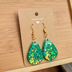 One pair of handmade teardrop-shaped earrings Made with bright, green confetti and epoxy resin  The perfect pair of groovy earrings for welcoming the warmer weathers, celebrating special moments and more! Each pair is assembled with hypoallergenic, nickel-free ear wire and safe for sensitive ears ---------------------------- RESIN CARE - Avoid long periods of direct sunlight to prevent yellowing - Wash with a very mild soap, warm water and a non abrasive cloth - Avoid submerging in water (remove Green Teardrop Drop Earrings For Jewelry Making, Green Teardrop Earrings For Gift, Green Teardrop Earrings As Gift, Green Teardrop Drop Earrings Nickel Free, Green Nickel-free Teardrop Earrings, Green Nickel-free Teardrop Drop Earrings, Handmade Green Teardrop Earrings, Green Teardrop Earrings For Pierced Ears, Gift, Green Teardrop Earrings For Party