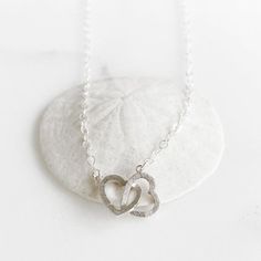 Double Heart Necklace in Sterling Silver. Simple Lovely Necklace. Valentines Day GiftThe linked hearts charm is silver plated. The necklace is 17" long on sterling silver chain.Questions?  Please don't hesitate to start a convo, we'd love to hear from you!_________________________________________________________WELCOME!Welcome to Rustic Gem Jewelry! Thank you for visiting our shop. We take custom orders and can often do a similar piece in different colors. We also offer bulk / bridal discounts. Affordable Sterling Silver Heart Necklace Gift, Rose Gold Drop Earrings, Double Heart Necklace, Gem Jewelry, Valentines Necklace, Double Heart, Lovely Necklace, Gems Jewelry, Gold Drop Earrings